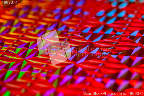 Image of Texture of red foil with holographic effect. Christmas background.