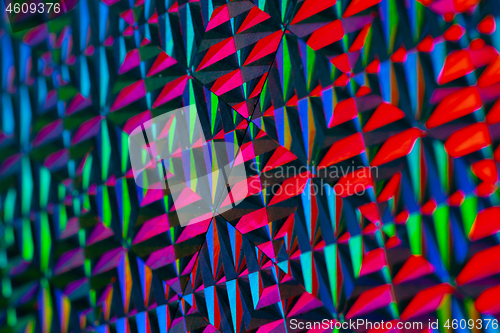 Image of Texture of red foil with holographic effect. Christmas background.