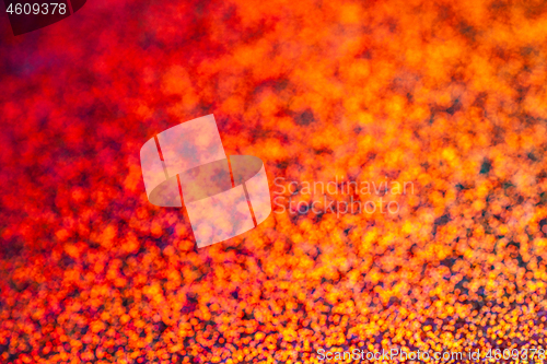 Image of Texture of red foil with holographic effect. Christmas background.