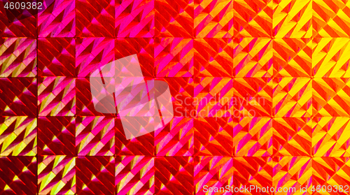 Image of Texture of red foil with holographic effect. Christmas background.