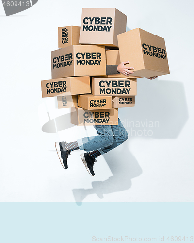 Image of Gift boxes in the hands of young man