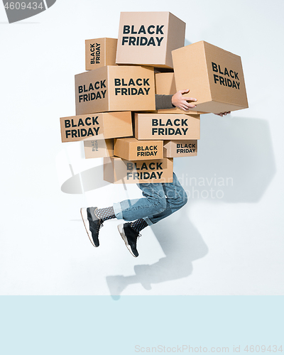 Image of Gift boxes in the hands of young man