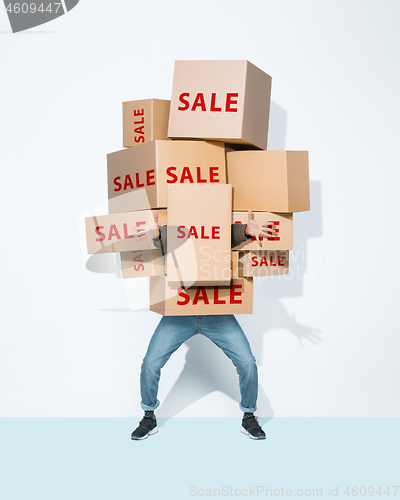 Image of Gift boxes in the hands of young man