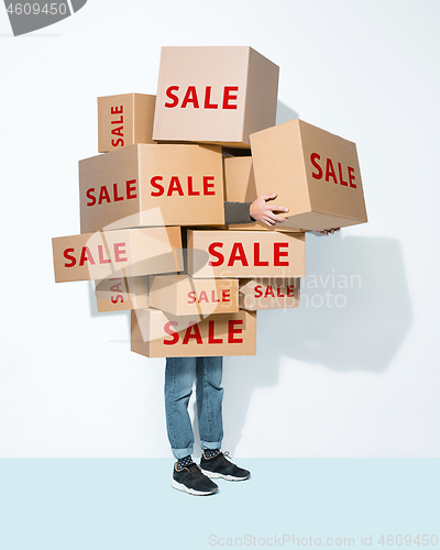 Image of Gift boxes in the hands of young man