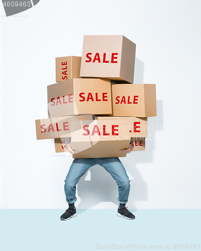 Image of Gift boxes in the hands of young man