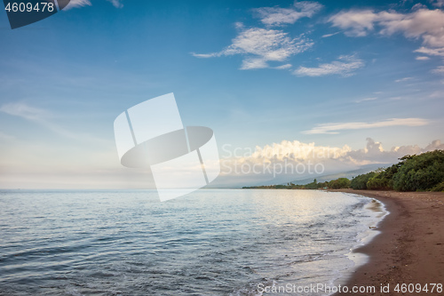 Image of a dark sand beach in northern Bali Indonesia