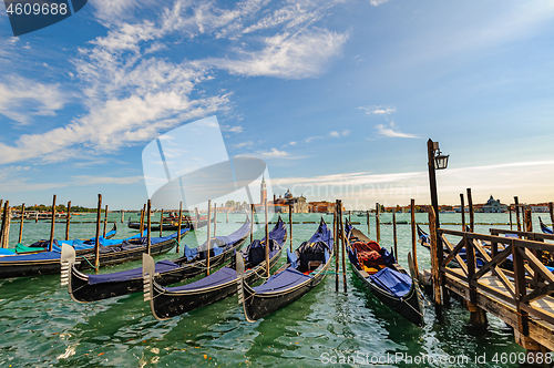 Image of Venice, Italy, Gondolas parked in Grand Canal