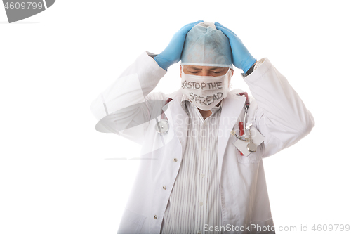 Image of Anguished overwhelmed doctor surgeon during virus pandemic