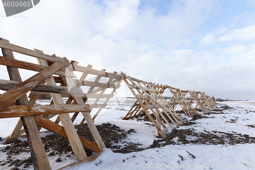 Image of Wooden fences in the field