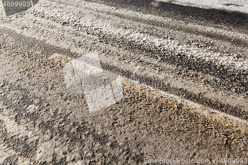 Image of snowy dirty road.