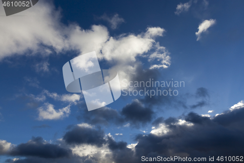 Image of cumulus clouds of gray and white close-up