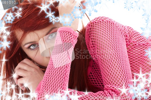 Image of mysterious redhead in pink fishnet