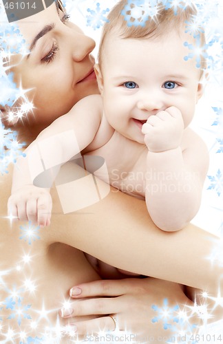 Image of clean happy baby in mother hands