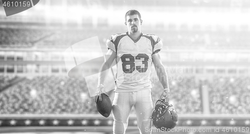 Image of American Football Player isolated on big modern stadium field