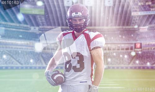 Image of American Football Player isolated on big modern stadium field