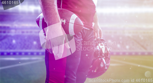 Image of closeup American Football Player isolated on big modern stadium