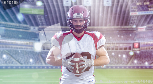 Image of American Football Player isolated on big modern stadium field