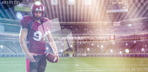 Image of American Football Player isolated on big modern stadium field