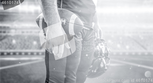 Image of closeup American Football Player isolated on big modern stadium