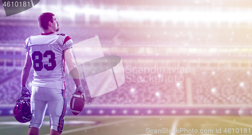 Image of American Football Player isolated on big modern stadium field