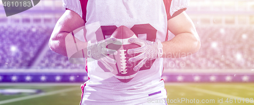 Image of closeup American Football Player isolated on big modern stadium