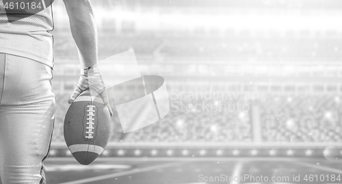 Image of closeup American Football Player isolated on big modern stadium