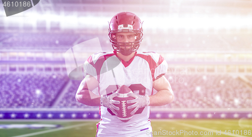 Image of American Football Player isolated on big modern stadium field