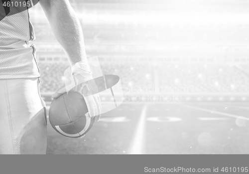 Image of closeup American Football Player isolated on big modern stadium