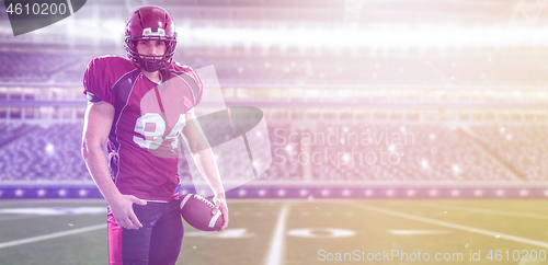 Image of American Football Player isolated on big modern stadium field