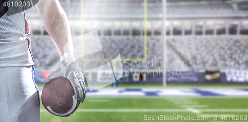 Image of closeup American Football Player isolated on big modern stadium