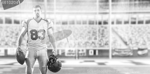 Image of American Football Player isolated on big modern stadium field