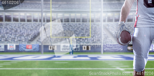 Image of closeup American Football Player isolated on big modern stadium