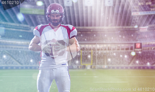 Image of American Football Player isolated on big modern stadium field