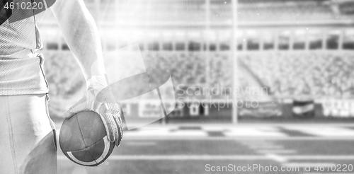 Image of closeup American Football Player isolated on big modern stadium