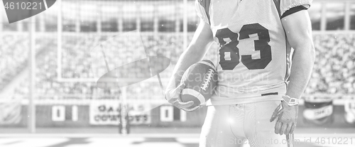 Image of closeup American Football Player isolated on big modern stadium