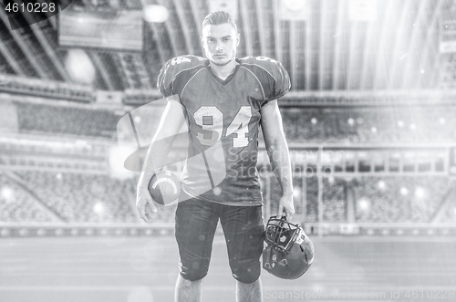 Image of American Football Player isolated on big modern stadium field