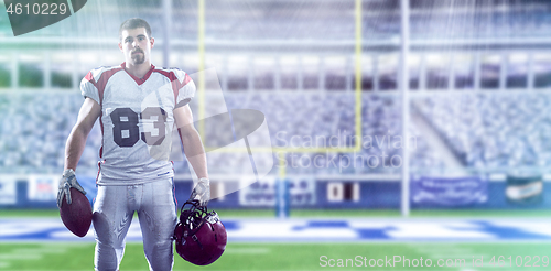 Image of American Football Player isolated on big modern stadium field