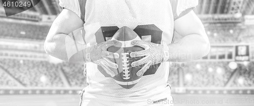 Image of closeup American Football Player isolated on big modern stadium