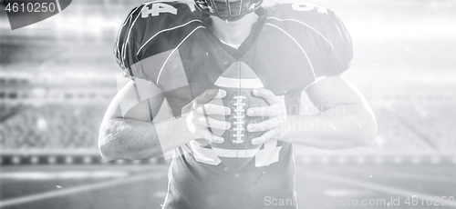 Image of closeup American Football Player isolated on big modern stadium