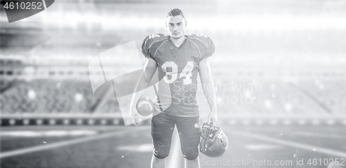 Image of American Football Player isolated on big modern stadium field