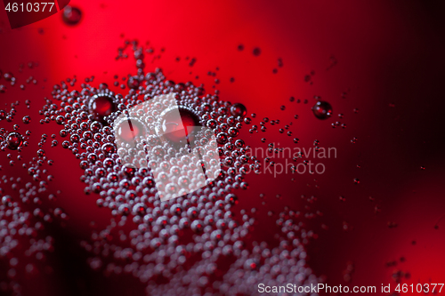 Image of Detail of a glass with red wine and bubbles
