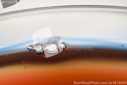 Image of Detail of a glass with red wine and bubbles