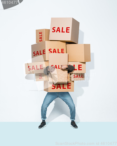 Image of Gift boxes in the hands of young man