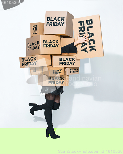 Image of Gift boxes in the hands of young woman