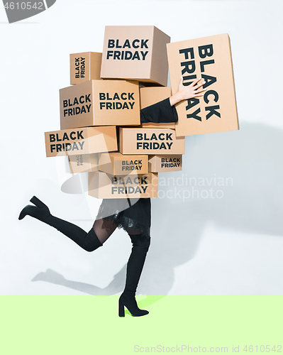 Image of Gift boxes in the hands of young woman