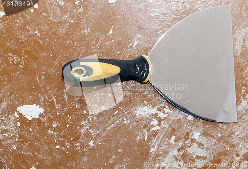 Image of metal spatula on the floor