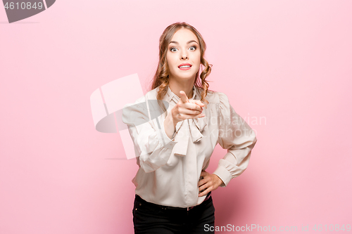 Image of The happy business woman point you and want you, half length closeup portrait on pink background.