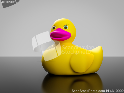 Image of yellow rubber duck with pink mouth and green eyes