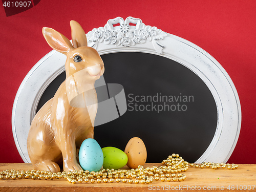 Image of Easter decoration rabbit and vintage frame