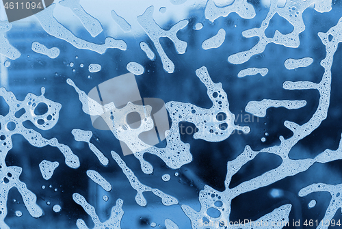 Image of Soap foam pattern on glass